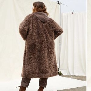 Fuzzy long brown jacket. Never worn. (Size 8-10 but fits big)